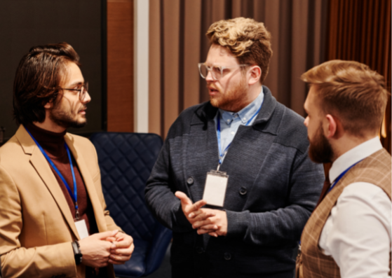 three men discuss